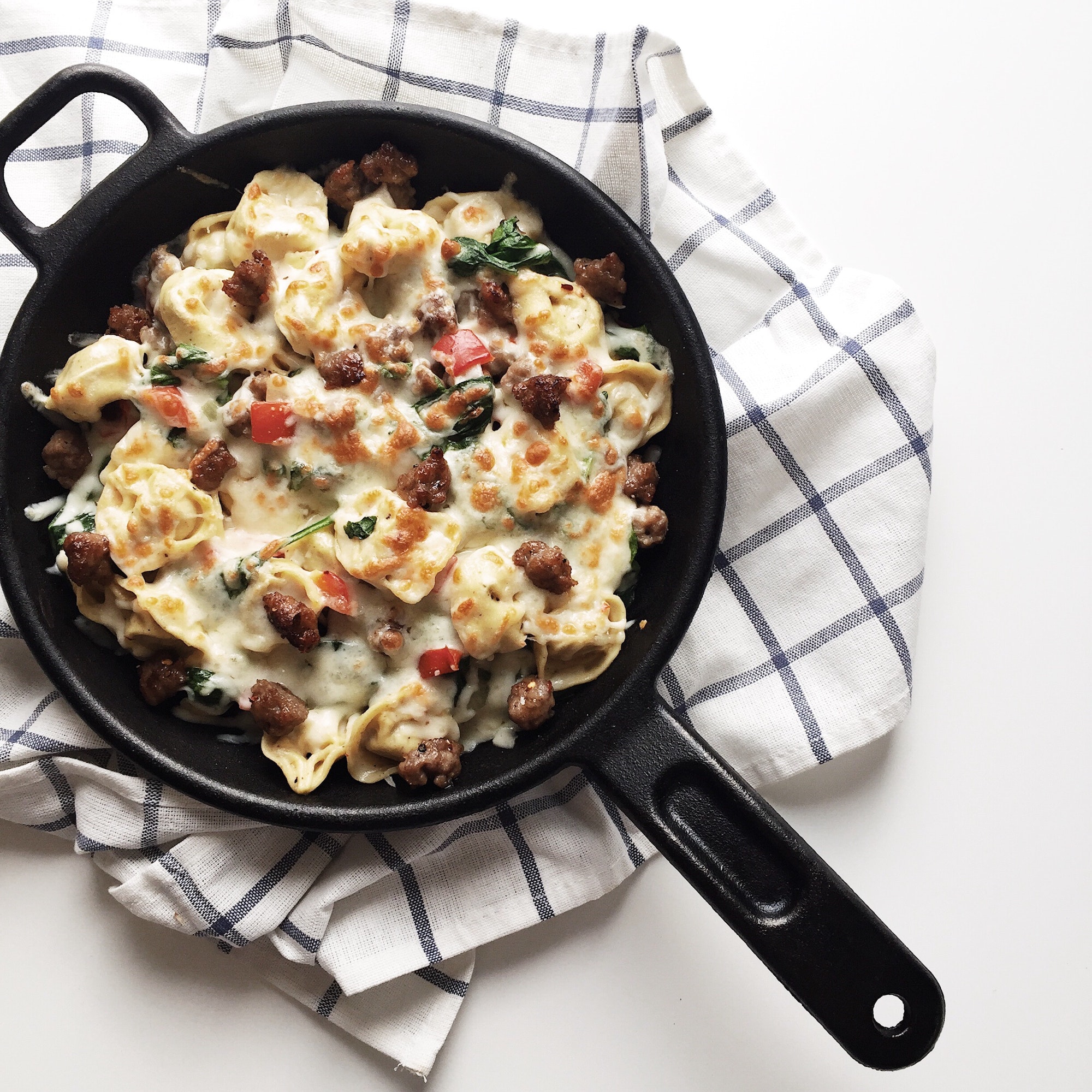 Baked pasta with Italian sausage, spinach, and red bell peppers