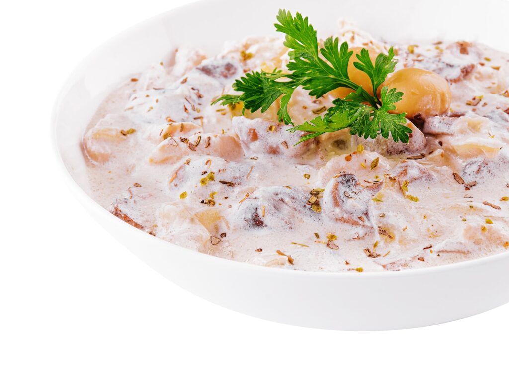 Chicken meat in cream sauce of mushrooms