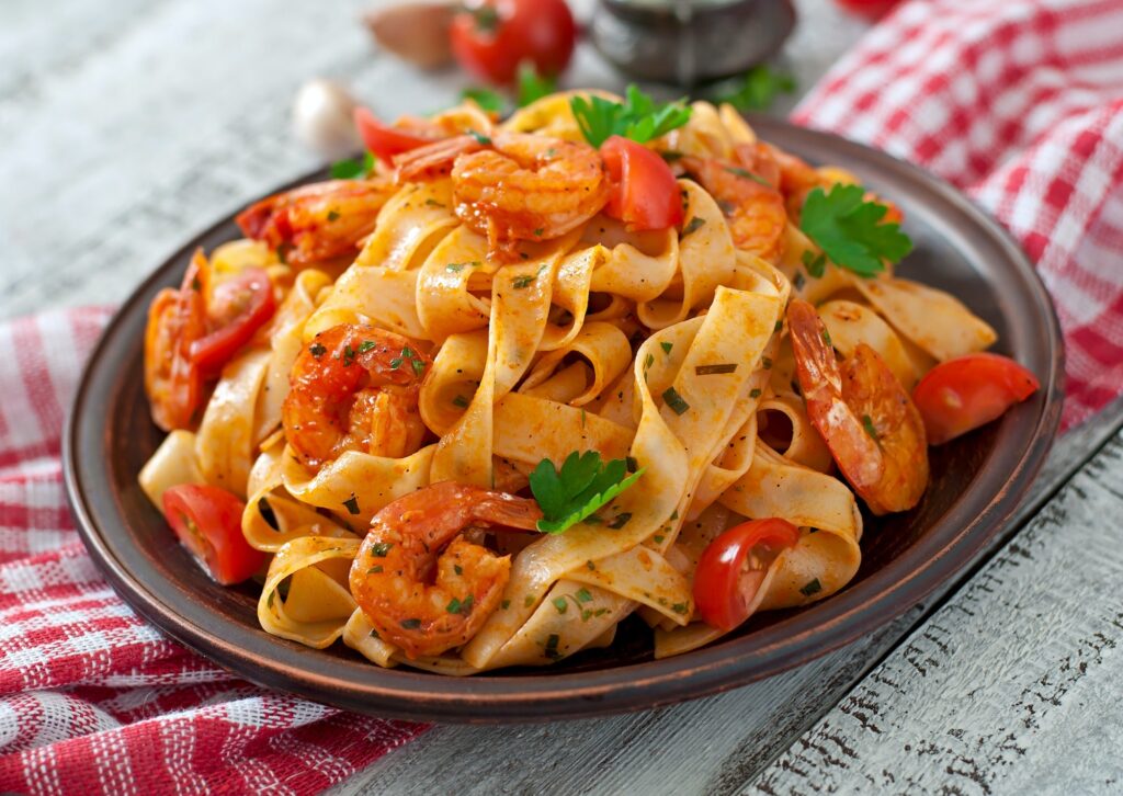 Fettuccine pasta with shrimp, tomatoes and herbs