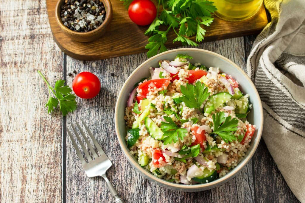 Food dieting concept, tuna salad. Couscous salad with conserved tuna.