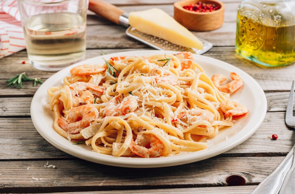 Pasta tagliatelle with shrimps in creamy sauce