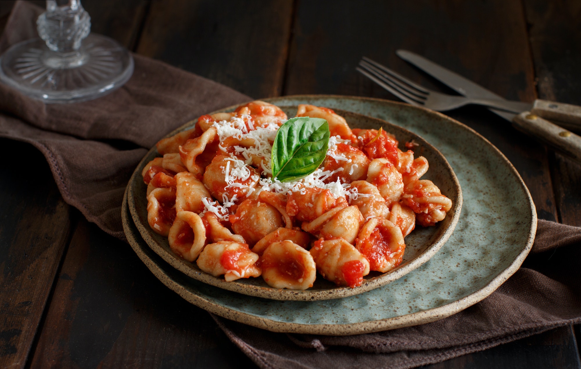South italian pasta orecchiette with tomato sauce and cacioricotta cheese